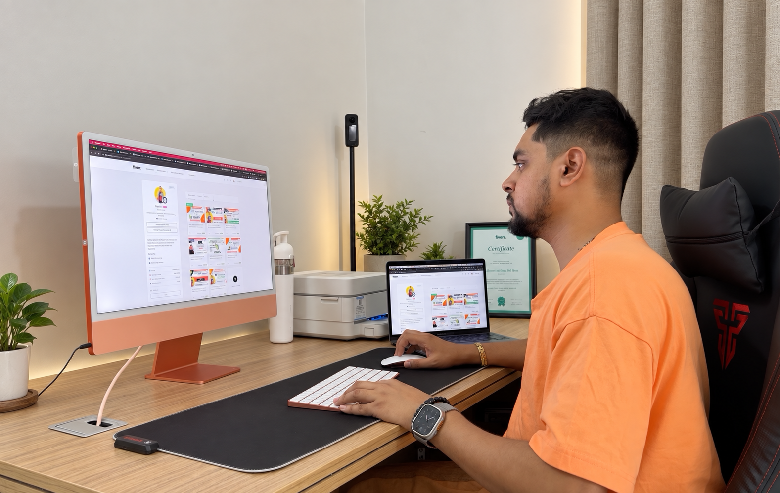 Shuvo working at his desk, reviewing client projects